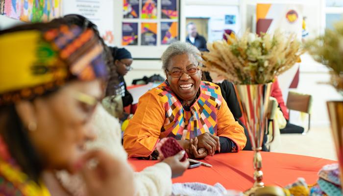 People socialising at a community event run by the Mojatu Foundation in Nottingham.